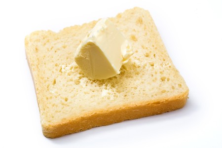 Stock photo: an image of yellow butter on a slice of breadの写真素材