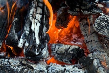 Stock photo: an image of black logs in fire 