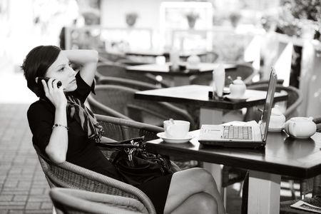 An image of a young woman in a small caffeの写真素材