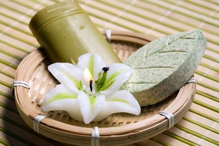 An image of a candle and two bars of soapの写真素材