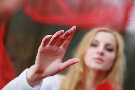 A nice woman with a red shawl in a forestの写真素材