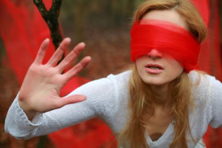 An image of woman with red blindfoldの写真素材