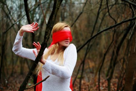 An image of blindfolded nice woman in the forestの写真素材