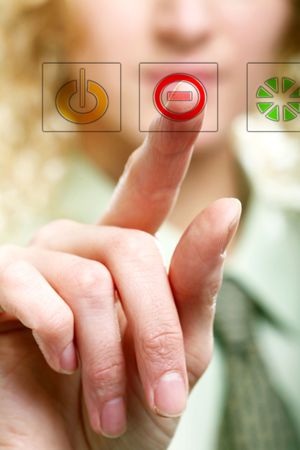 An image of a finger pressing a buttonの写真素材