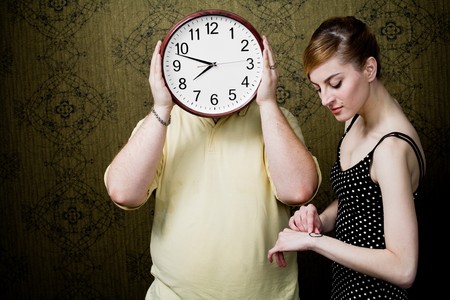 An image of a man with a clock and a womanの写真素材