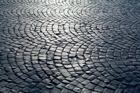 An image of a beautiful old road of grey stones