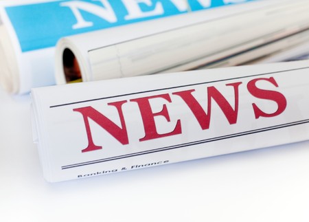 An image of three rolls of newspaperの写真素材