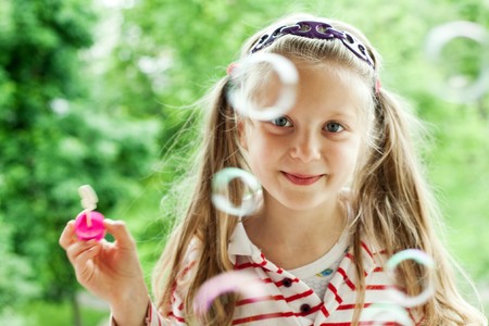An image of a nice girl with bubblesの写真素材
