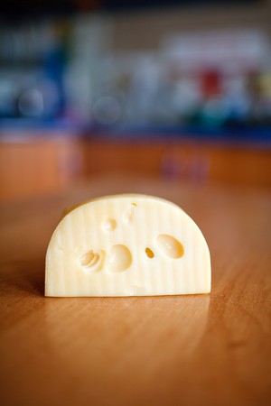 An image of slab of cheese on tableの写真素材