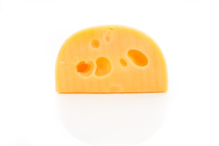 An image of slab of cheese on whiteの写真素材