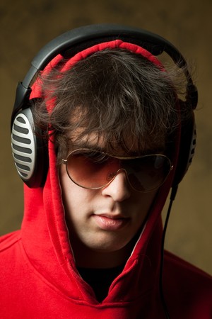 An image of a young man listening to music in headphonesの写真素材