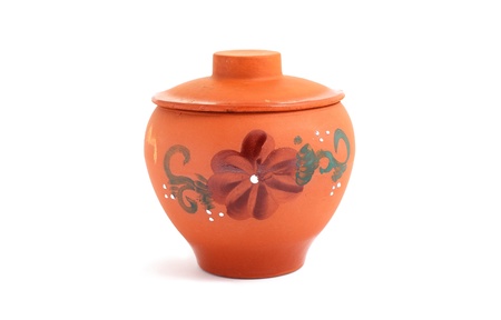 Orange clay pot with a pattern for meal preparationの写真素材