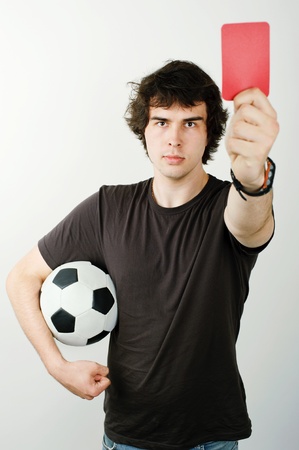 An image of a referee showing red card