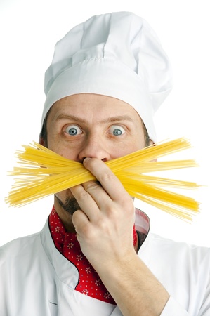 Young chef with funny mustache of spaghetti の写真素材