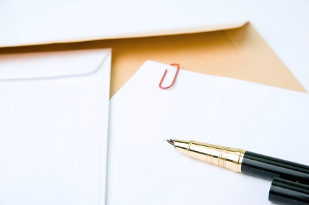 An image of an empty letter and a pen on itの写真素材