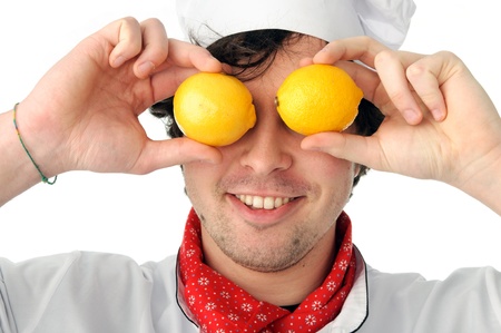 An image of a joyful chef with lemonsの写真素材