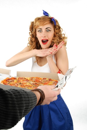 Young woman with tasty pizza in delivery paperの写真素材