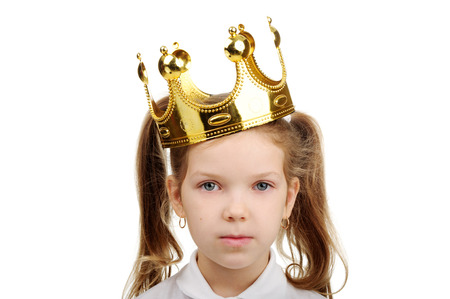 A little girl wears a crown.の写真素材