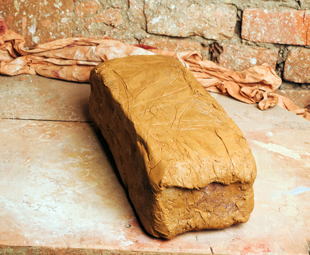 An image of a brick of clay in workshopの写真素材