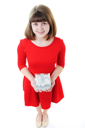 Young girl in red dress with gift boxの写真素材