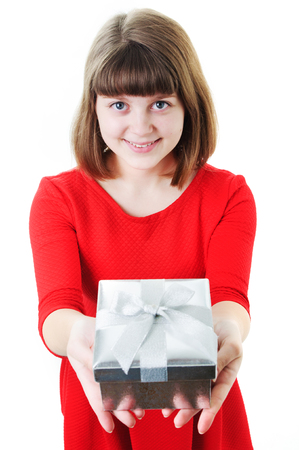 An image of young girl with gift box on whiteの写真素材