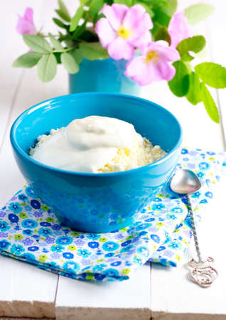 Cottage cheese  in  blue bowl. Healthy foodの写真素材