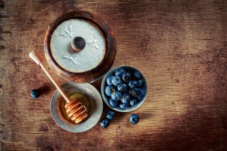 Honey with blueberriesの写真素材