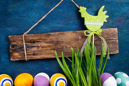 Wooden board for text and Easter decorationsの写真素材