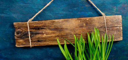 wooden board on a textured surface with copyspaceの写真素材