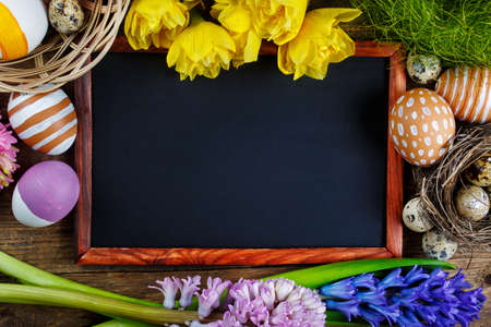 Colorful Easter eggs and Black board, Top viewの写真素材