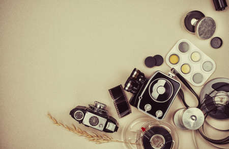 Retro vintage movie camera  and photo camera with copyspaceの写真素材