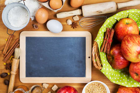 Ingredients for apple pie and vintage blackboard with copyspaceの写真素材