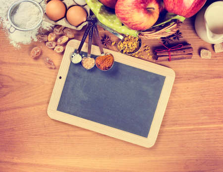 Vintage chalk board and ingredients for baking, Toned image
