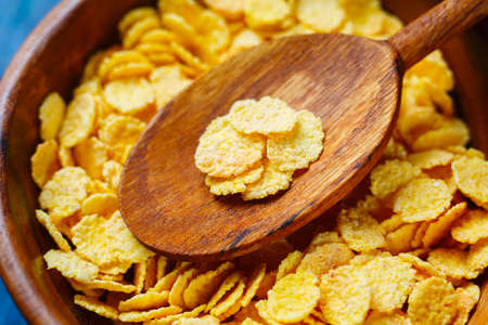 Golden corn flakes close up.   Selective focus.
