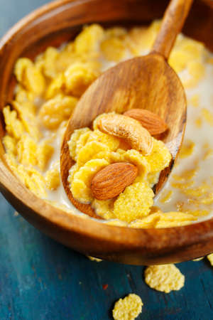 Cornflakes with nuts close up. Selective focus