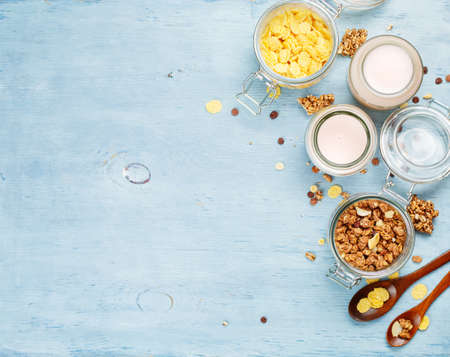 Yogurt with muesli and cornflakes. Health and diet concept. Food background with copyspaceの写真素材