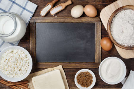 Traditional baking ingredients with vintage chalkboard. Rustic background with free text space.の写真素材