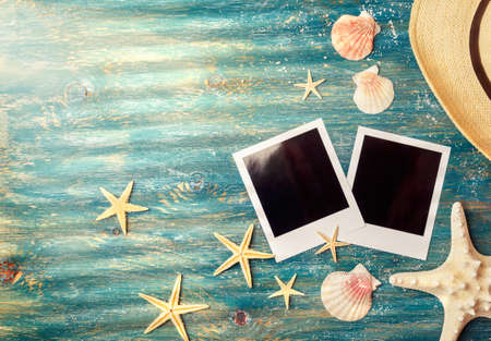 Blank  pictures with sea shells and starfish on a turquoise background