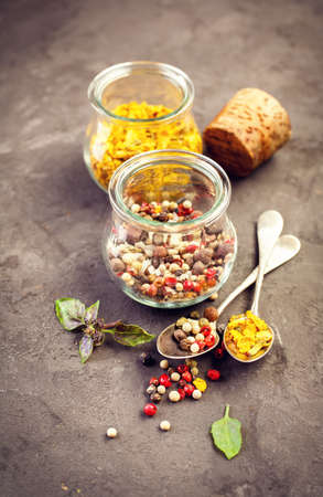 Pepper spice mix, ingredients for cooking on a rustic  background. Top view, selective focusの写真素材