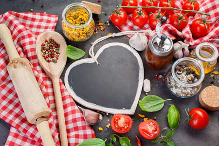 Black chalk board and spices on a dark background.の写真素材