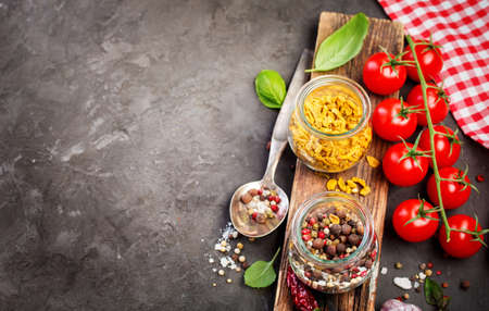 Ingredients for cooking, spice and cherry tomatoes. Food background with copy spaceの写真素材