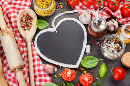 Different spice  and black chalk board for recipes or food menuの写真素材