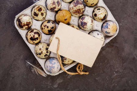 Fresh quail eggs. Quail eggs and a blank tag with copy space. Farm products, bio product, food...