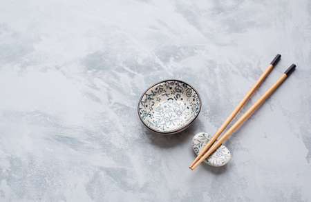 Chopsticks and  sauce bowl  with copyspace. Japanese Cuisineの写真素材