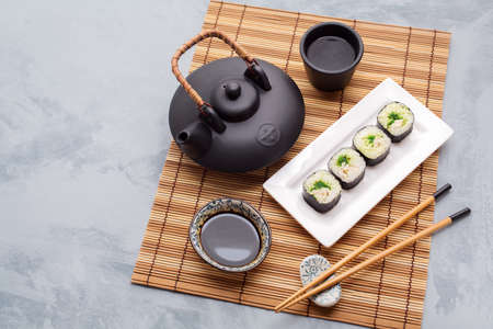 Japanese Cuisine. Traditional asian tea set and sushi.  Food background with copyspaceの写真素材
