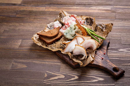 Traditional Russian appetizer to the drinks. Mashed potatoes with green onion, lard bacon and bread.の写真素材