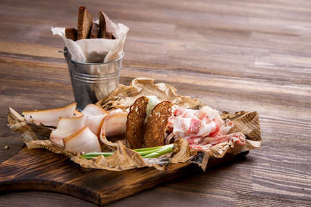 Traditional Russian snacks to beer. Mashed potatoes with green onion, lard bacon and bread.の写真素材