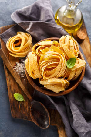 Fettuccine pasta ingredients for Italian food. Food background, top viewの写真素材