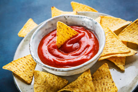 Nachos on plate and hot sauce, selective focus. Concept of mexican foodの写真素材