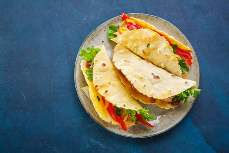 Mexican Food Chicken Tacos on a blue background. The view from the top.の写真素材